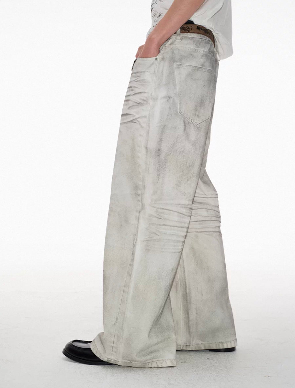 Dirty-dyed vintage white denim, natural dirty wash finish, pre-cat whisker crease detailing, straight wide-leg cut.