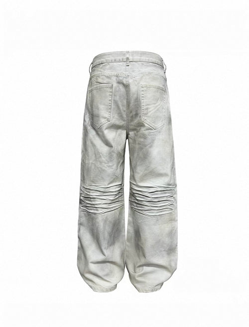 Dirty-dyed vintage white denim, natural dirty wash finish, pre-cat whisker crease detailing, straight wide-leg cut.